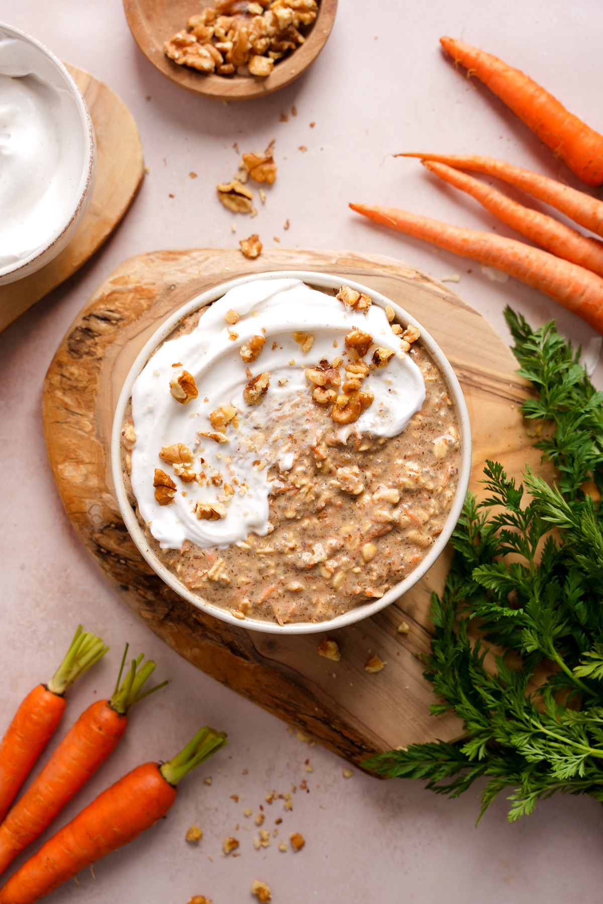 looking down at the carrot cake overnight oats with fresh carrots and crushed walnuts