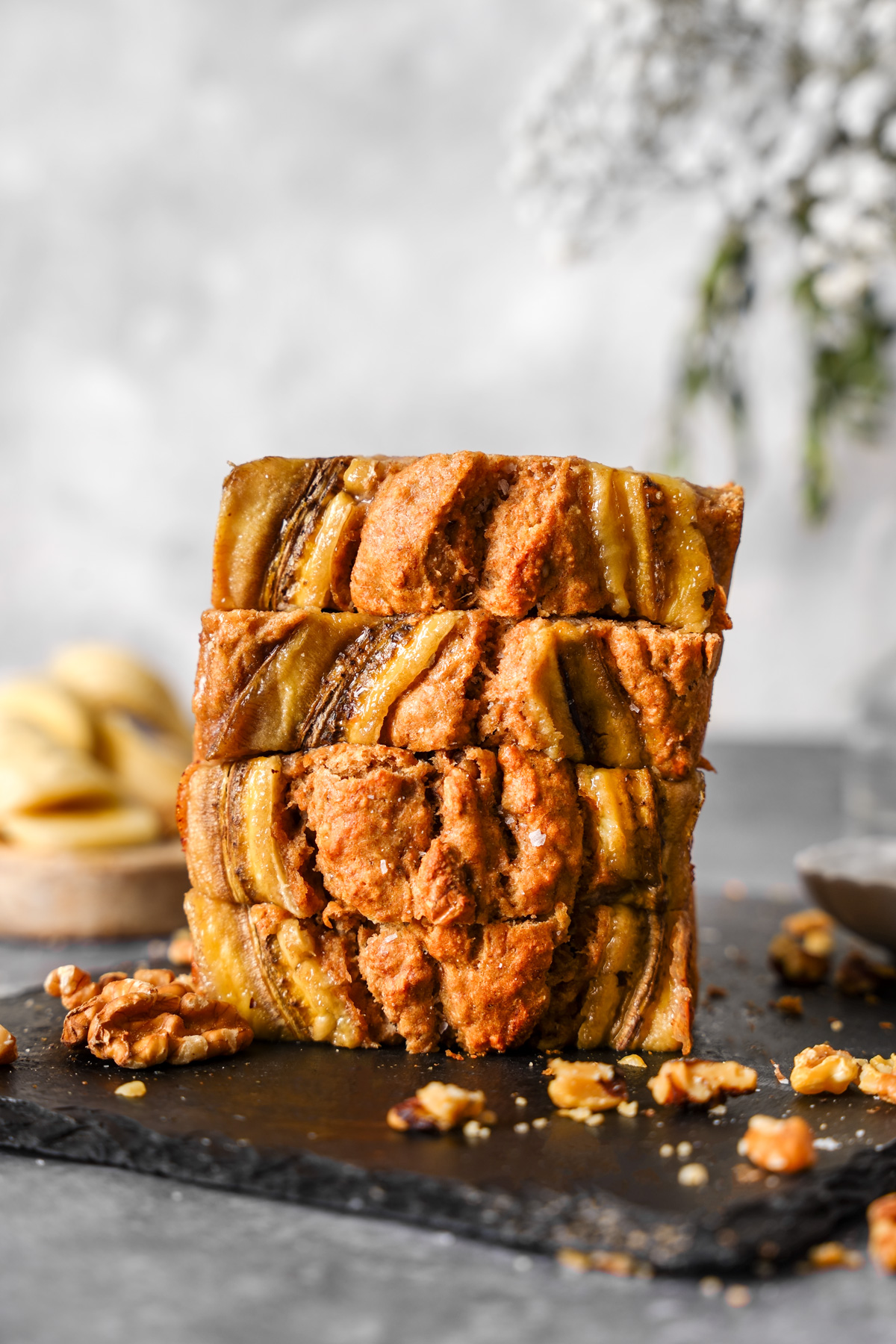 the vegan banana bread stacked on top of each other