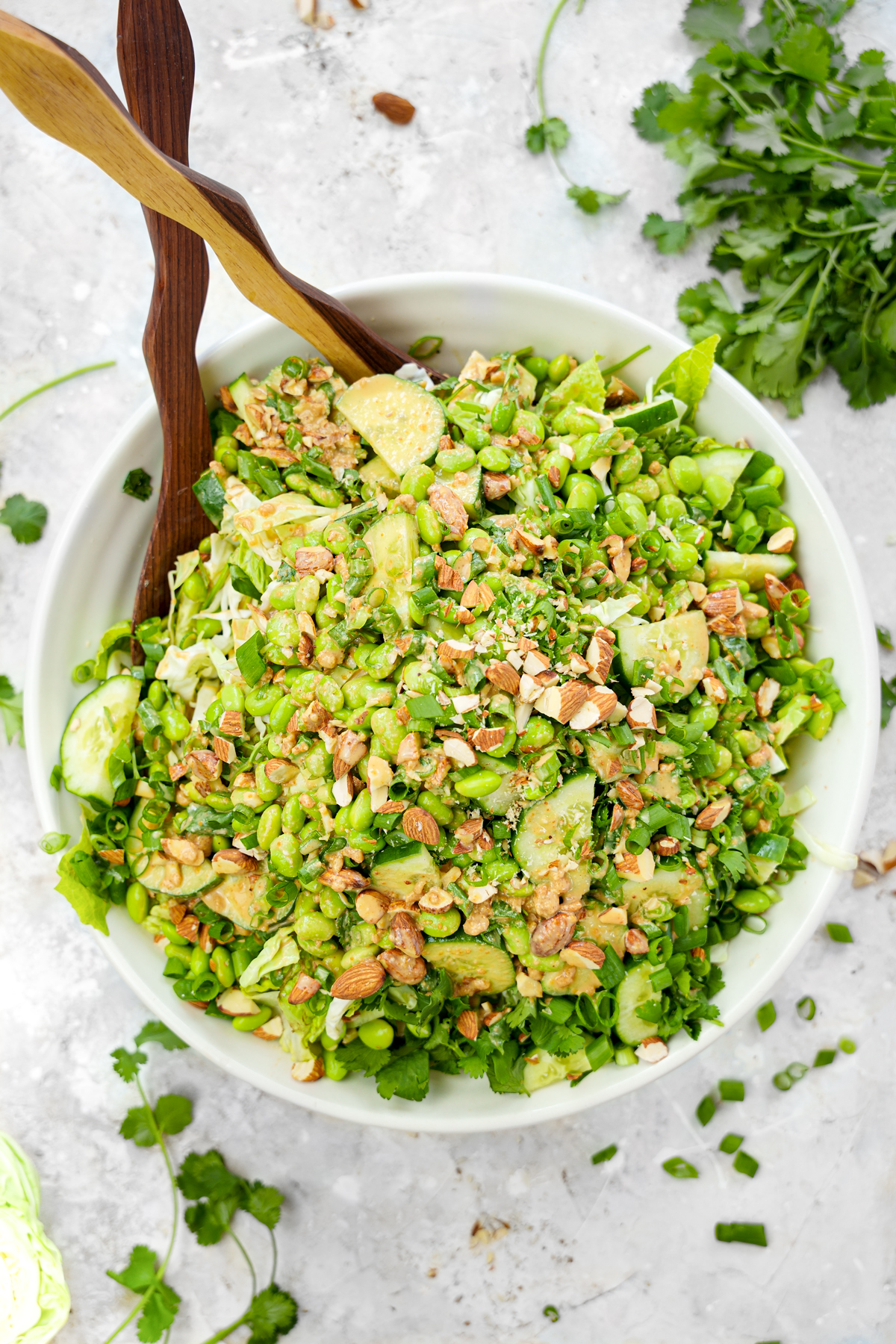 asian edamame crunch salad with peanut butter dressing on top