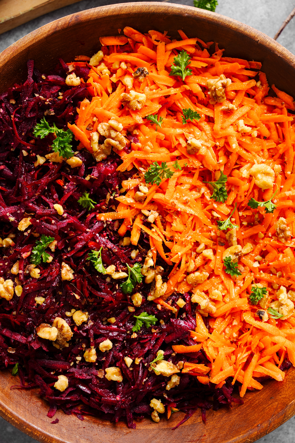 a close up of the beet and carrot salad in a large bowl