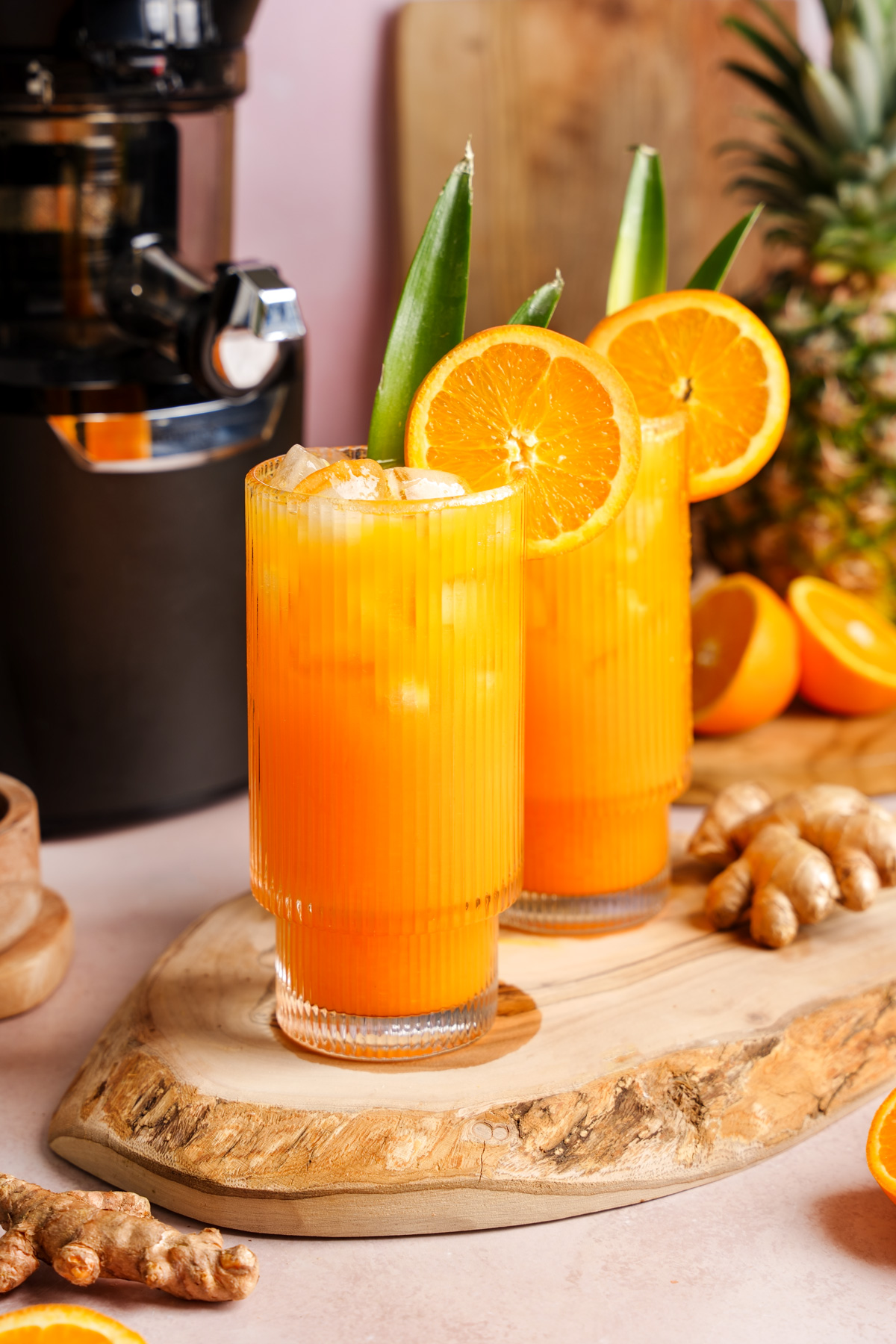 the turmeric ginger glow juice next to the kuvings auto10 plus