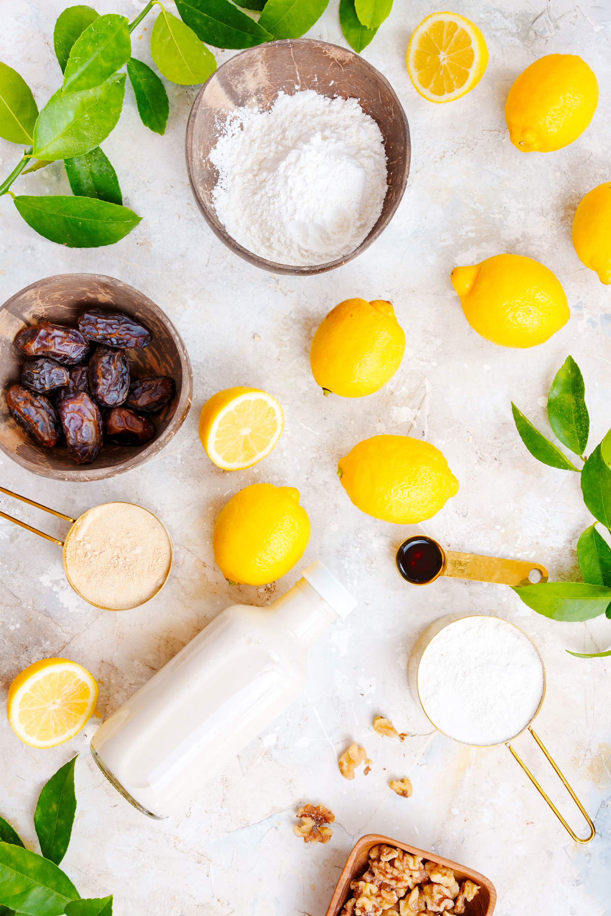 ingredients for this recipe: lemons, dates, cassava flour, vanilla, almond milk, walnuts, and cornstarch