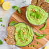 raw vegan pea soup with crackers and walnuts on top