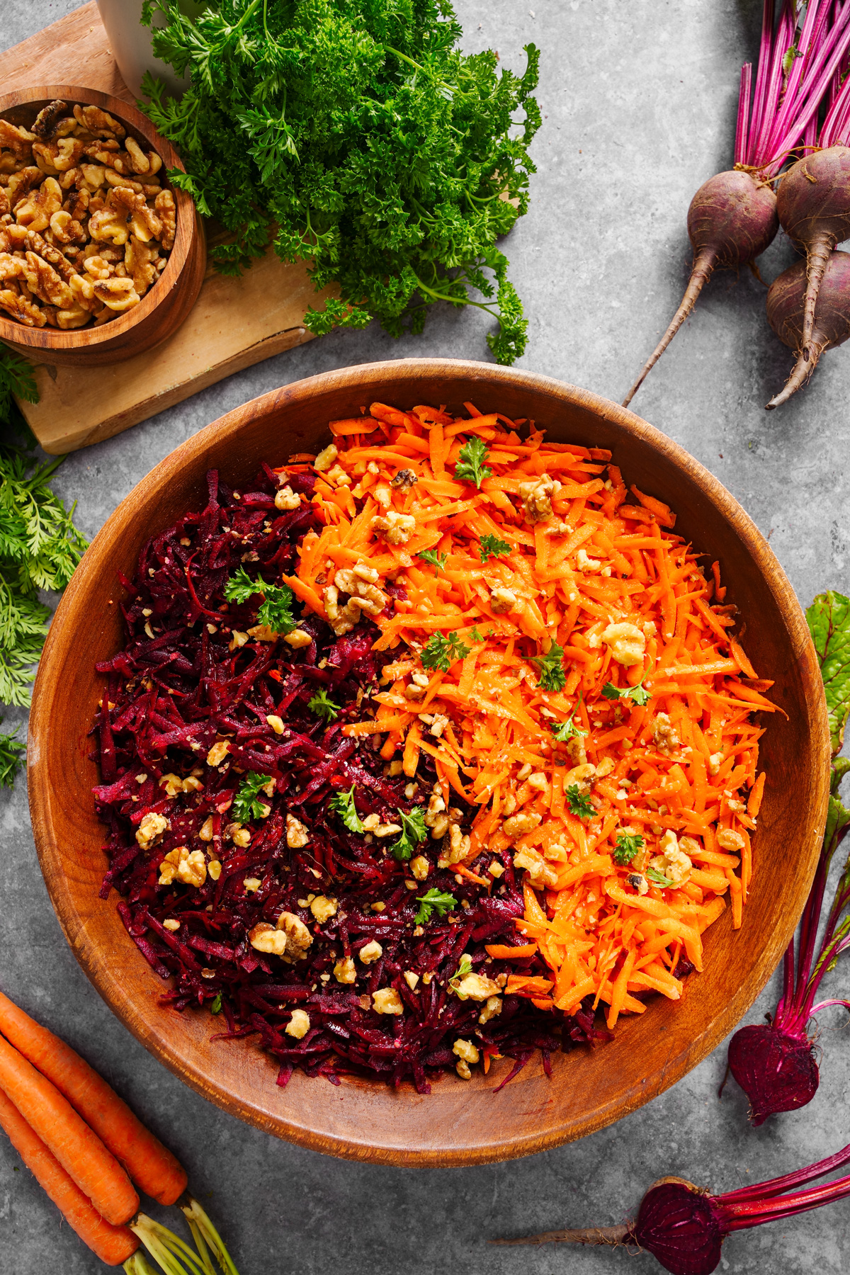 the beetroot cart salad surrounded by fresh carrots and beets