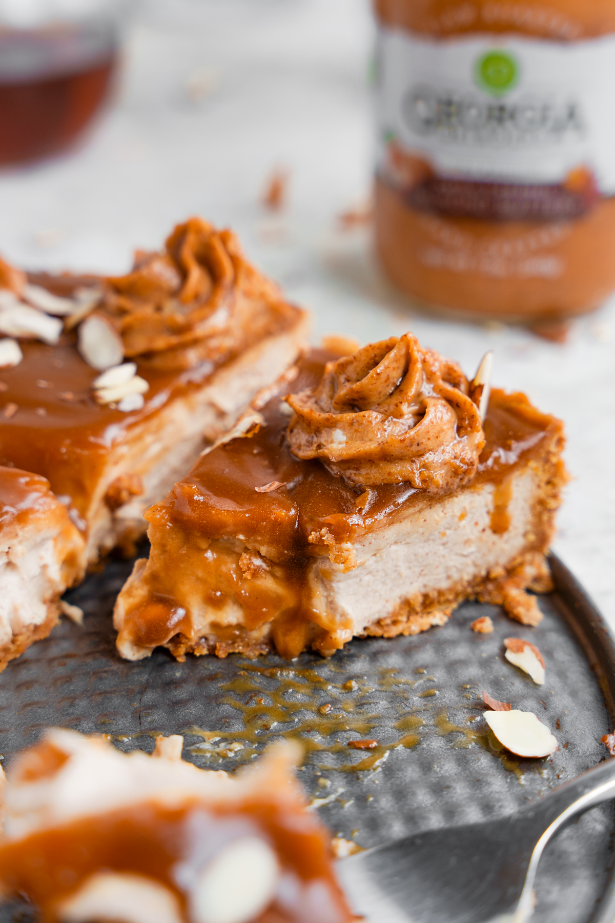 close up of the healthy vegan cheesecake to show the caramel sauce and the creamy texture