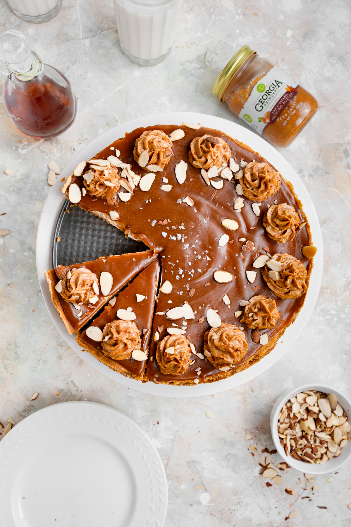 sliced vegan caramel cheesecake overhead showing the beautiful toppings