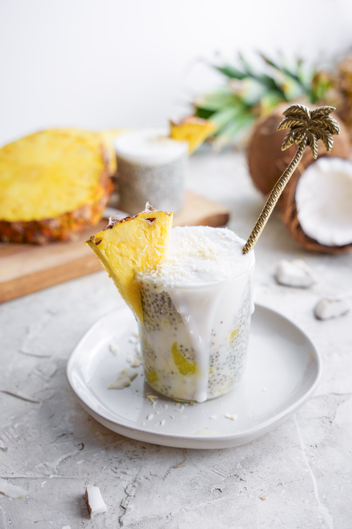 Pineapple chia seed pudding with tropical spoons