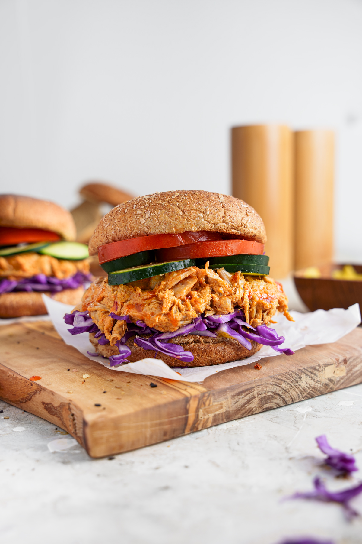 pulled jackfruit burger recipe with tomatoes cucumber and purple cabbage
