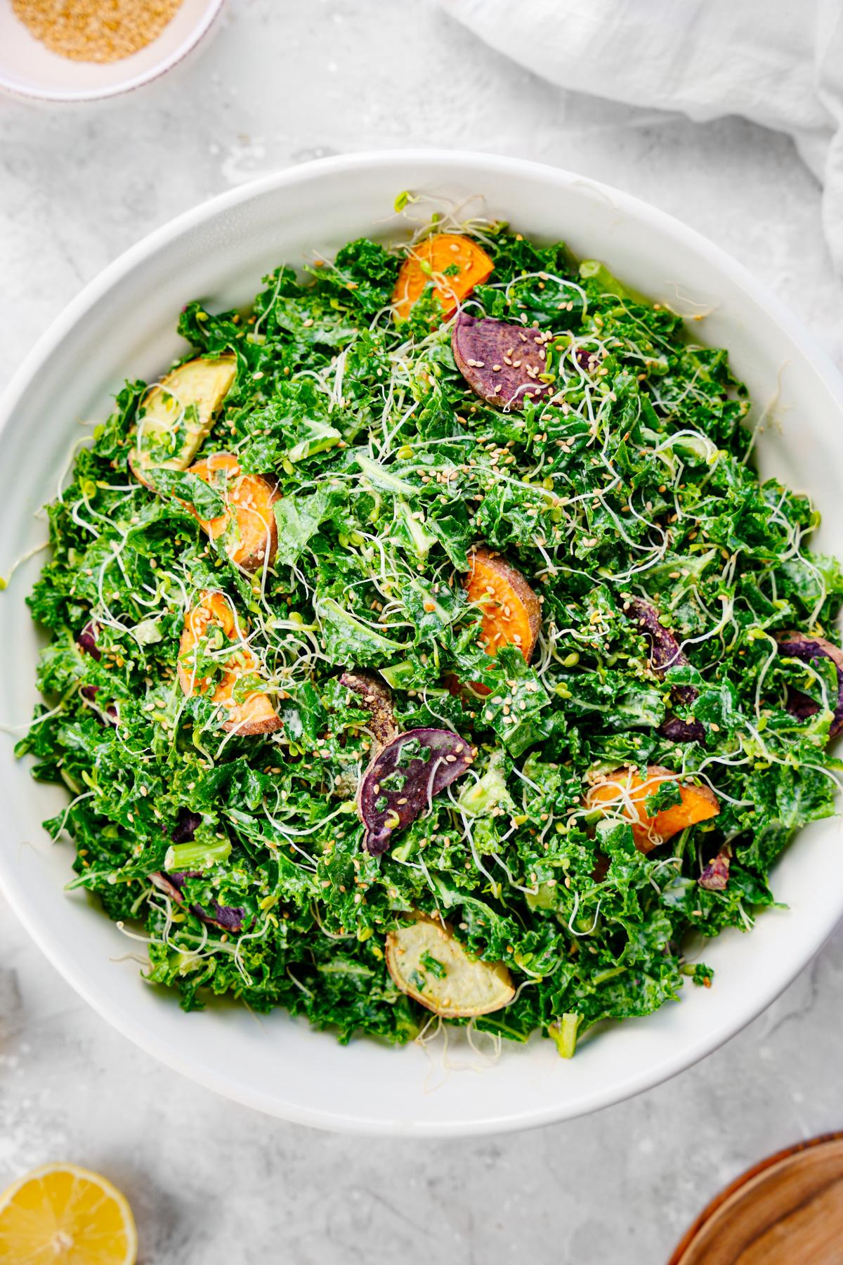 the kale salad with sprouts, sesame seeds, and rainbow sweet potatoes