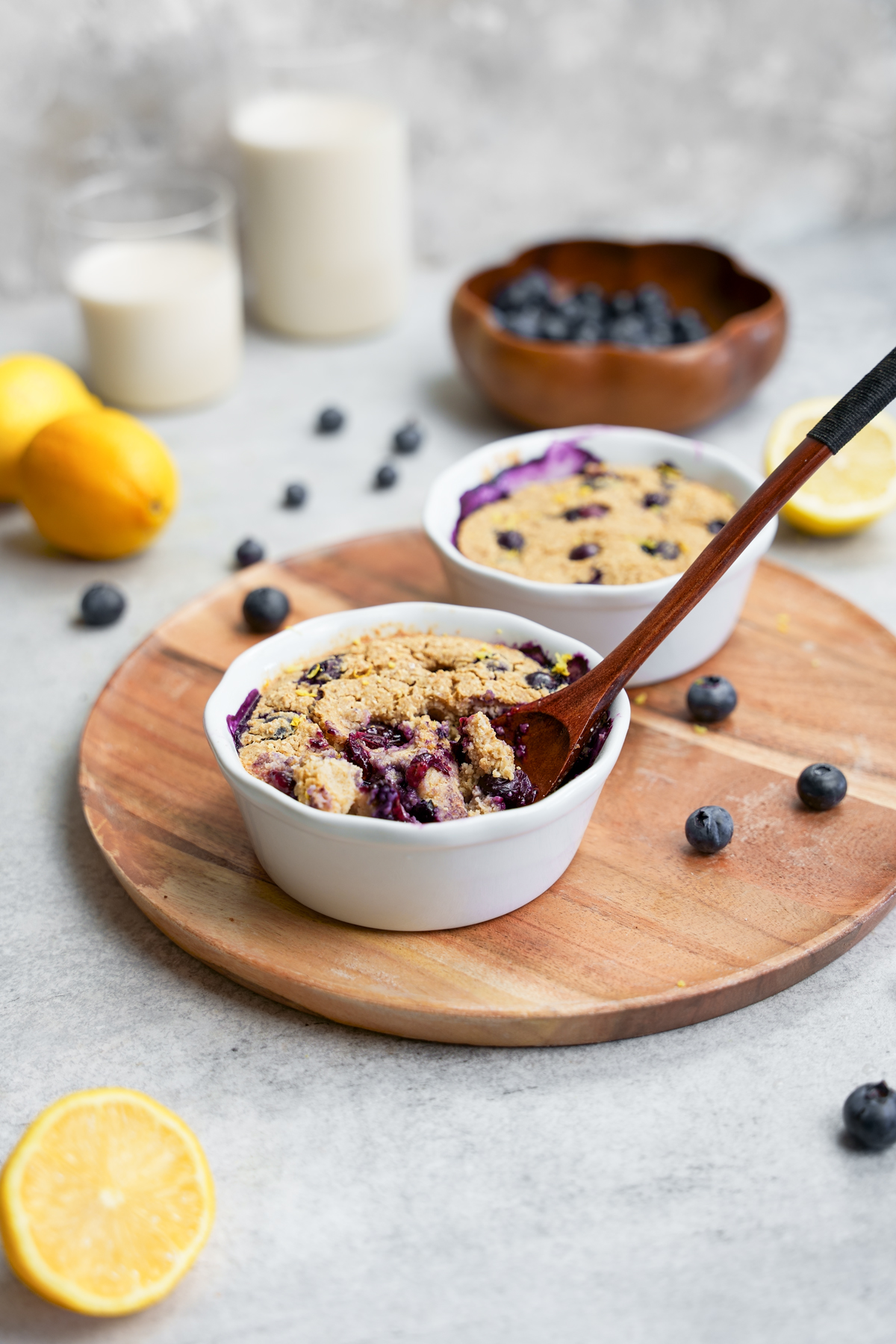 the lemon blueberry baked oatmeal with a bite taken out to show the fluffy cake like texture