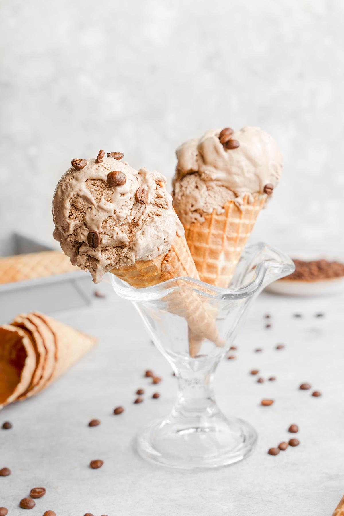 the vegan coffee ice cream with espresso beans on top of the scoops