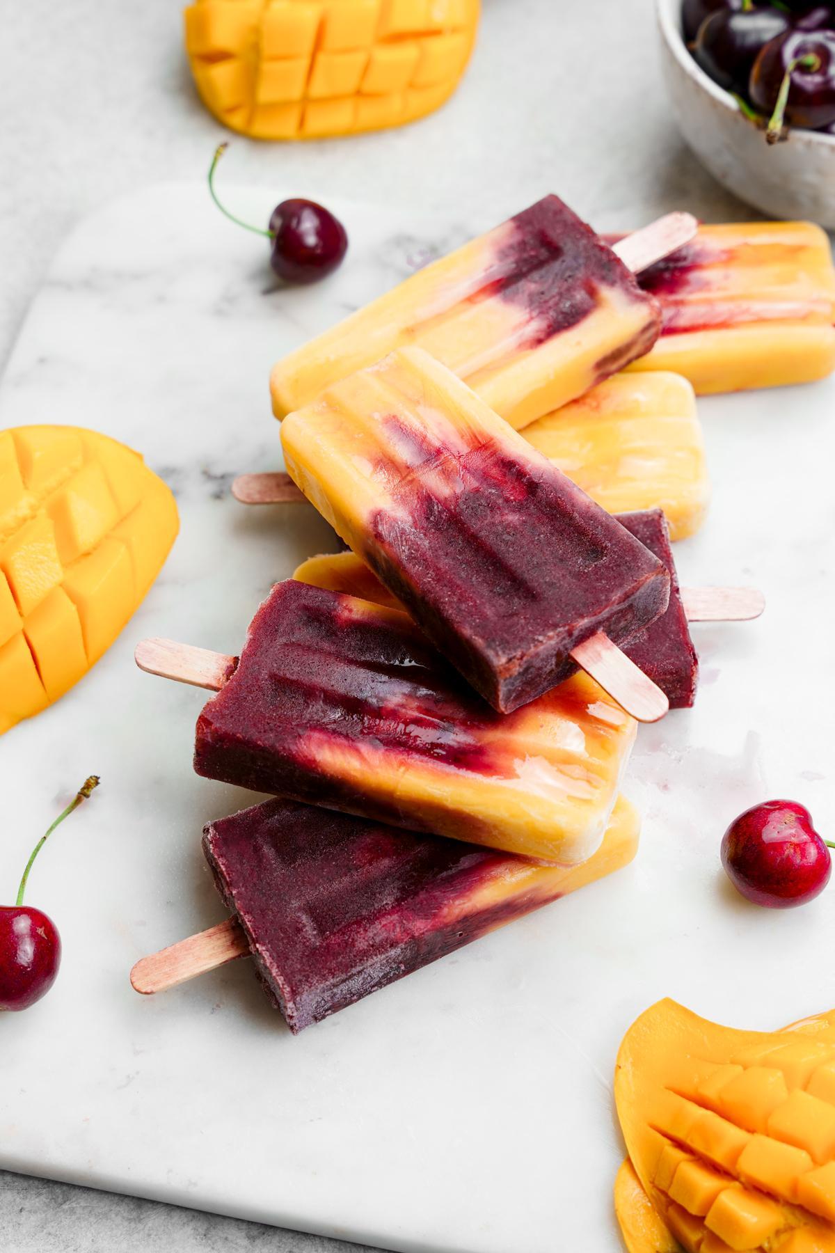 looking down at the cherry mango popsicles showing the swirls