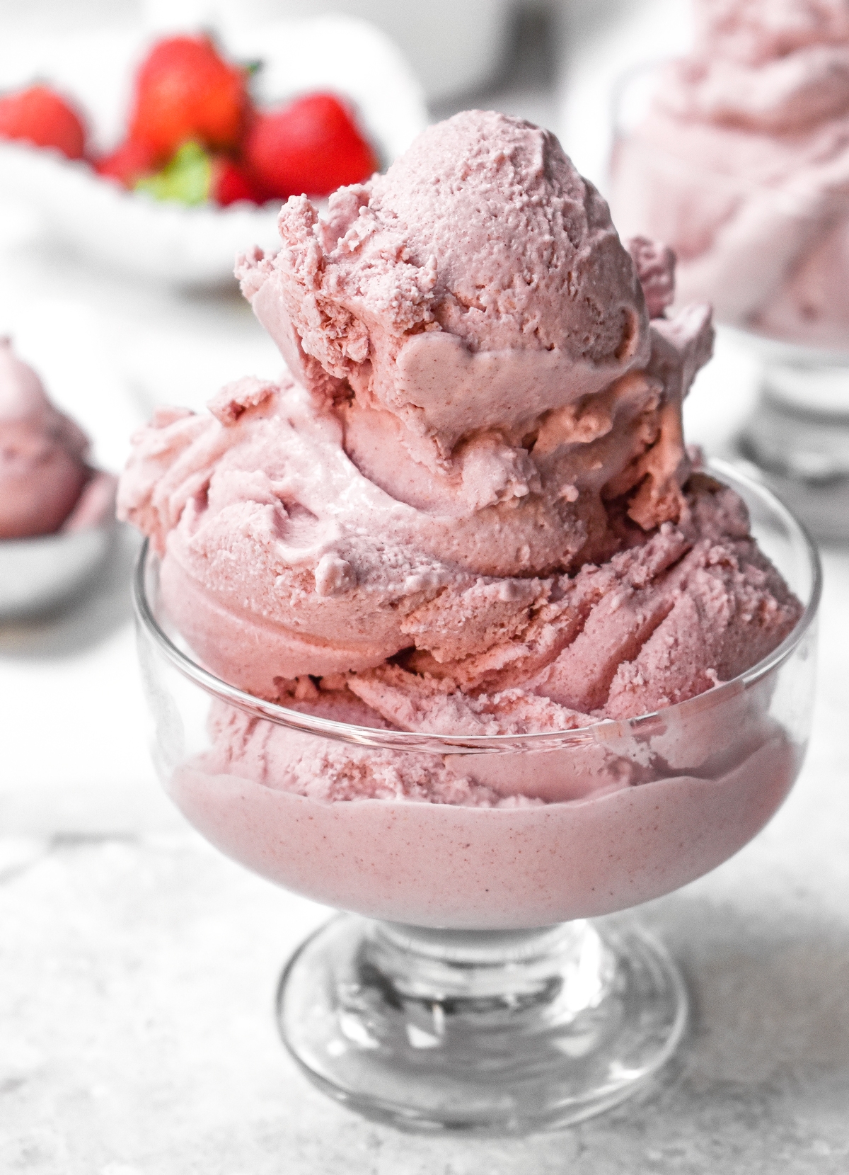 the healthy vegan strawberry ice cream scooped into a bowl