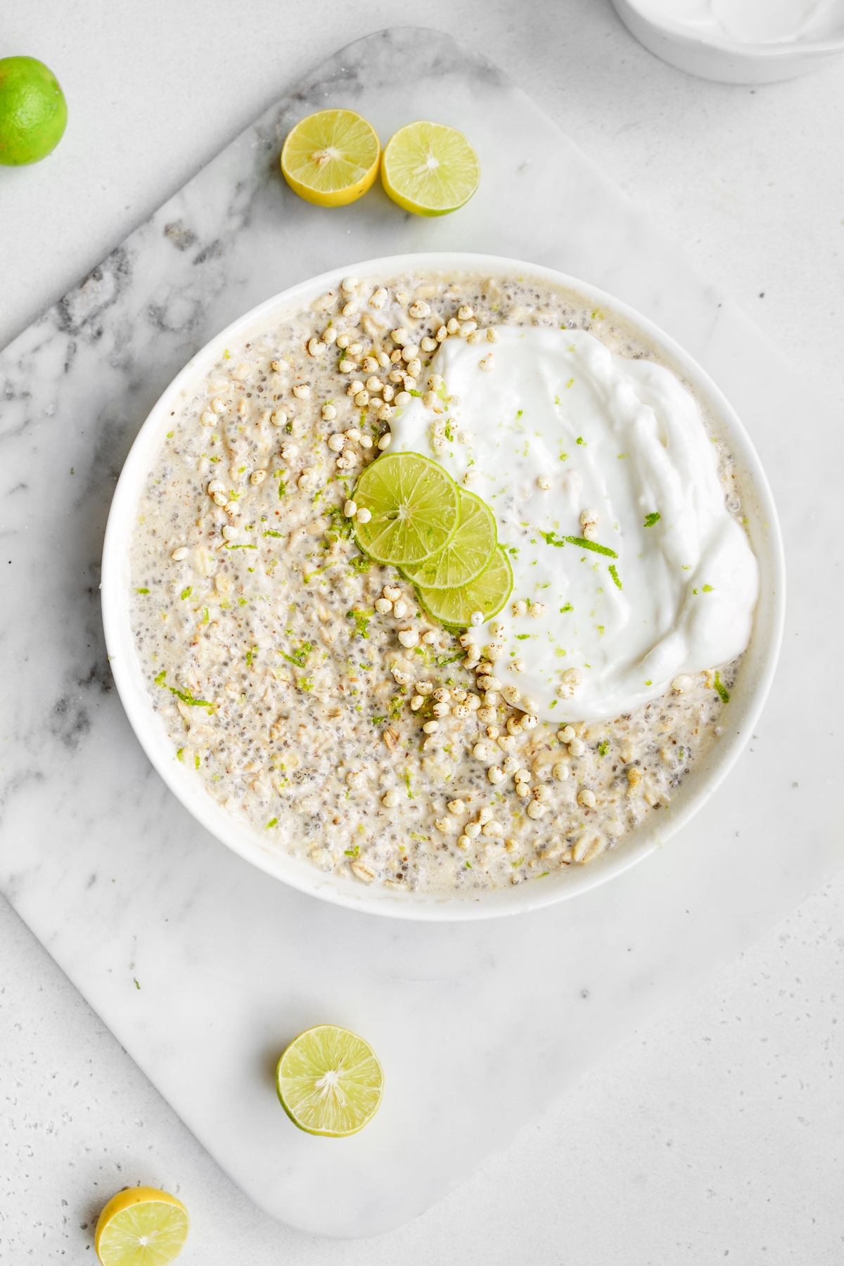 looking down at the key lime pie overnight oats with the vegan yogurt and fresh cut key limes
