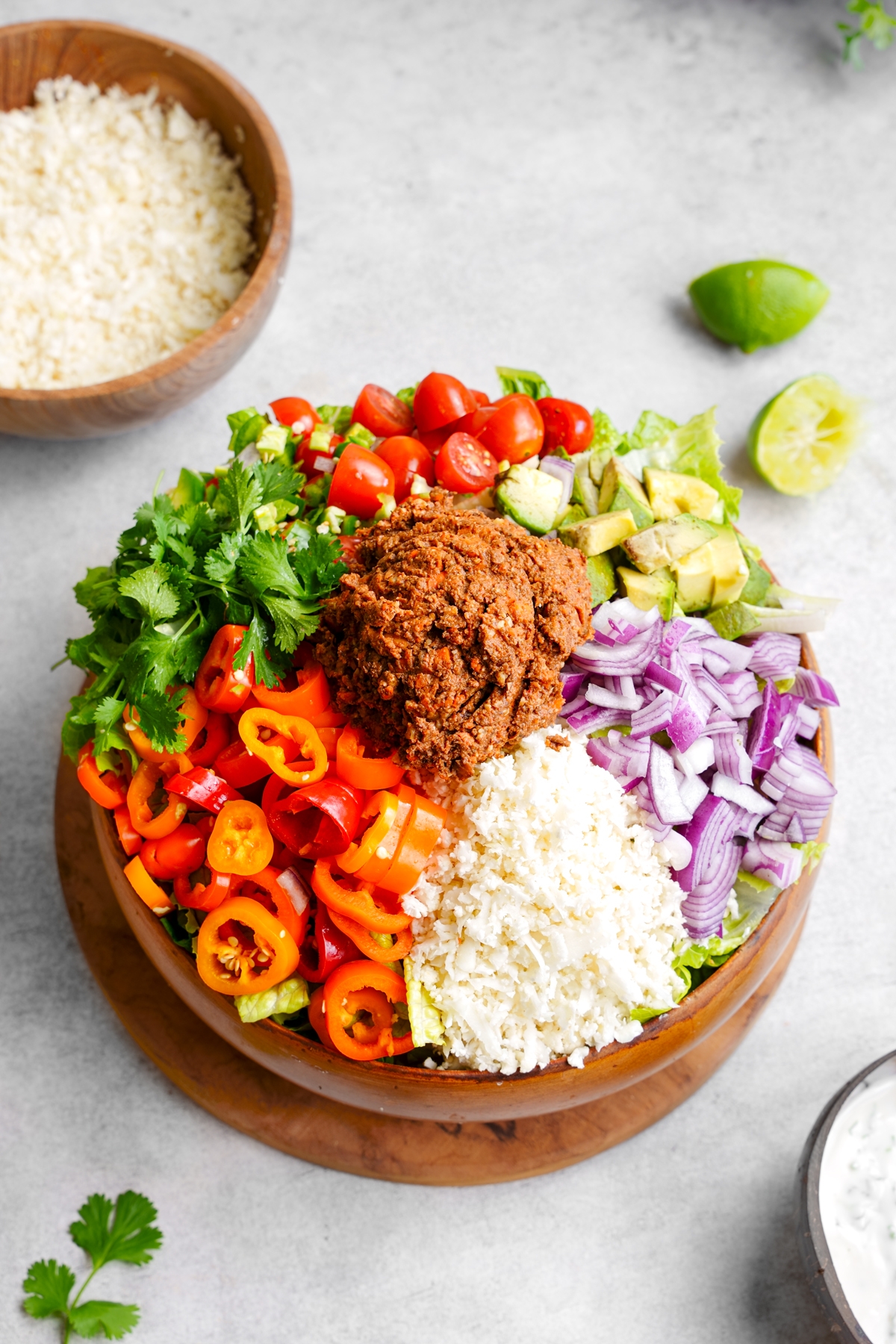 the raw vegan taco salad recipe in a large bowl the the creamy dressing on the side