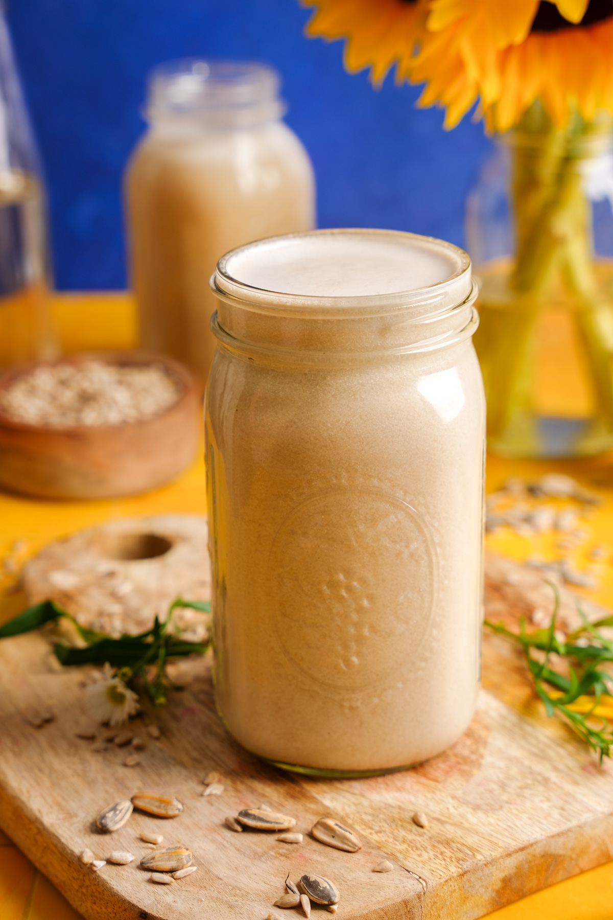 the sunflower seed milk poured into a mason jar for storage