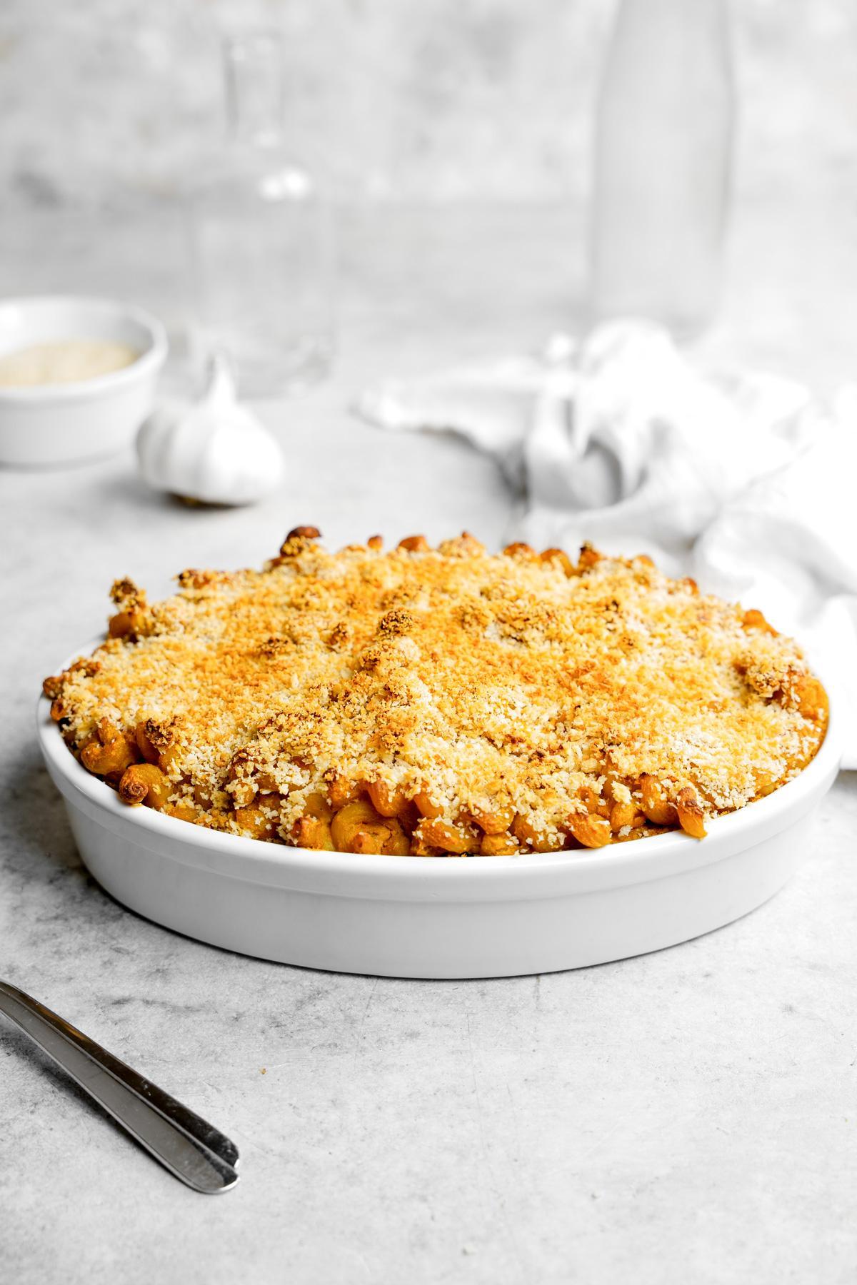 Sweet Potato Mac and cheese in a casserole dish with crispy bread crumbs on top