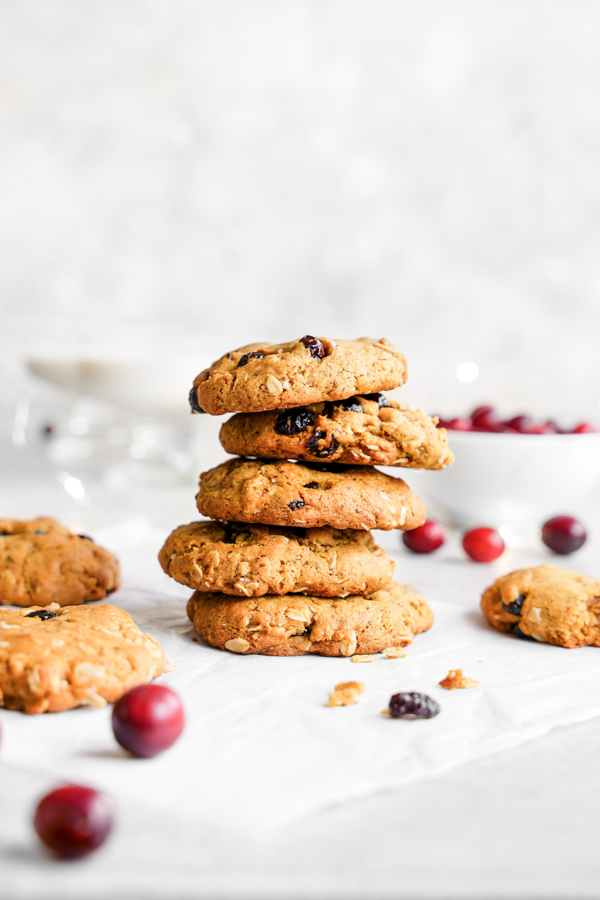 the vegan oatmeal cranberry cookies stacked on top of each other