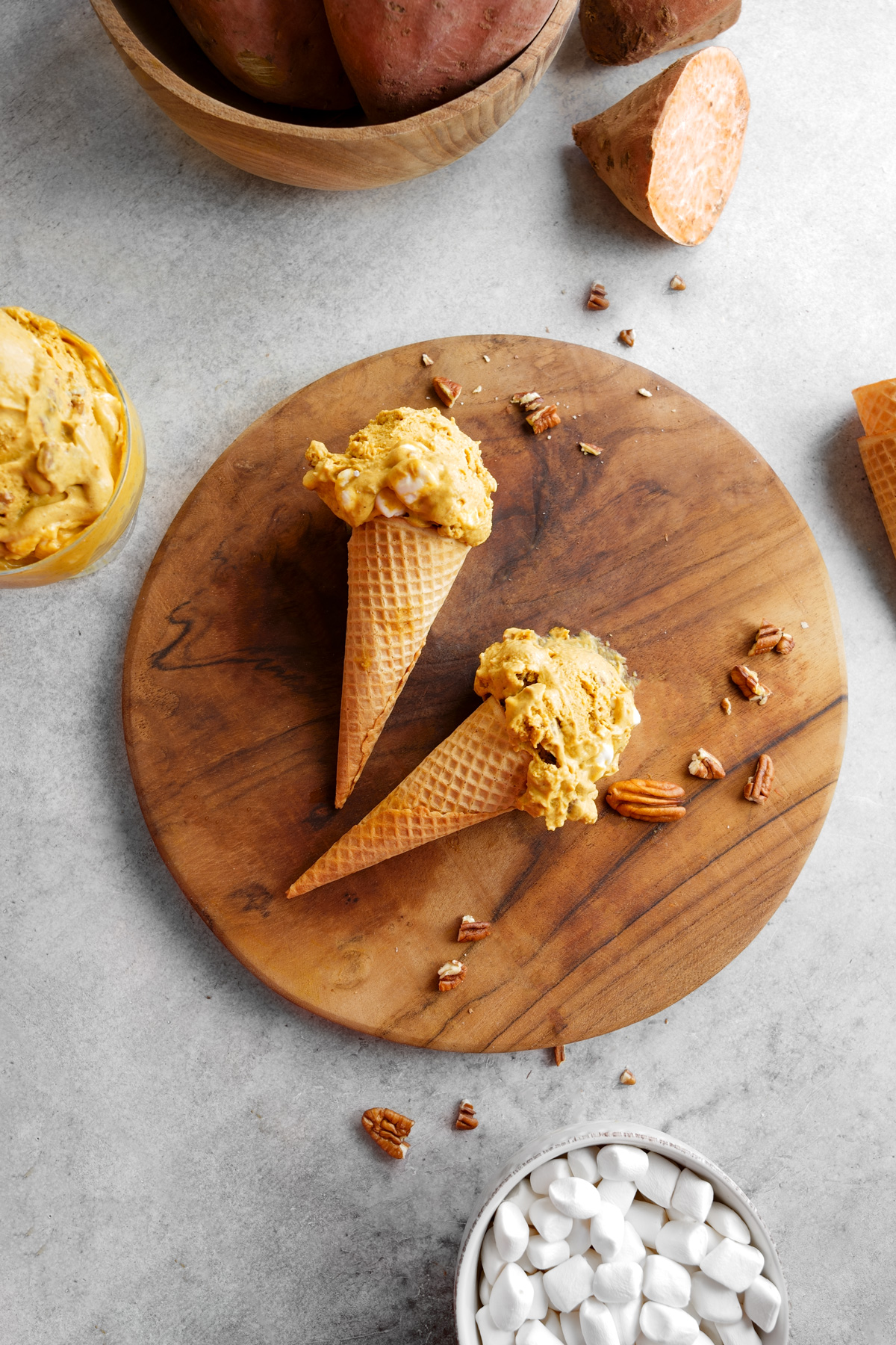 the sweet potato ice cream scooped into cones laying flat