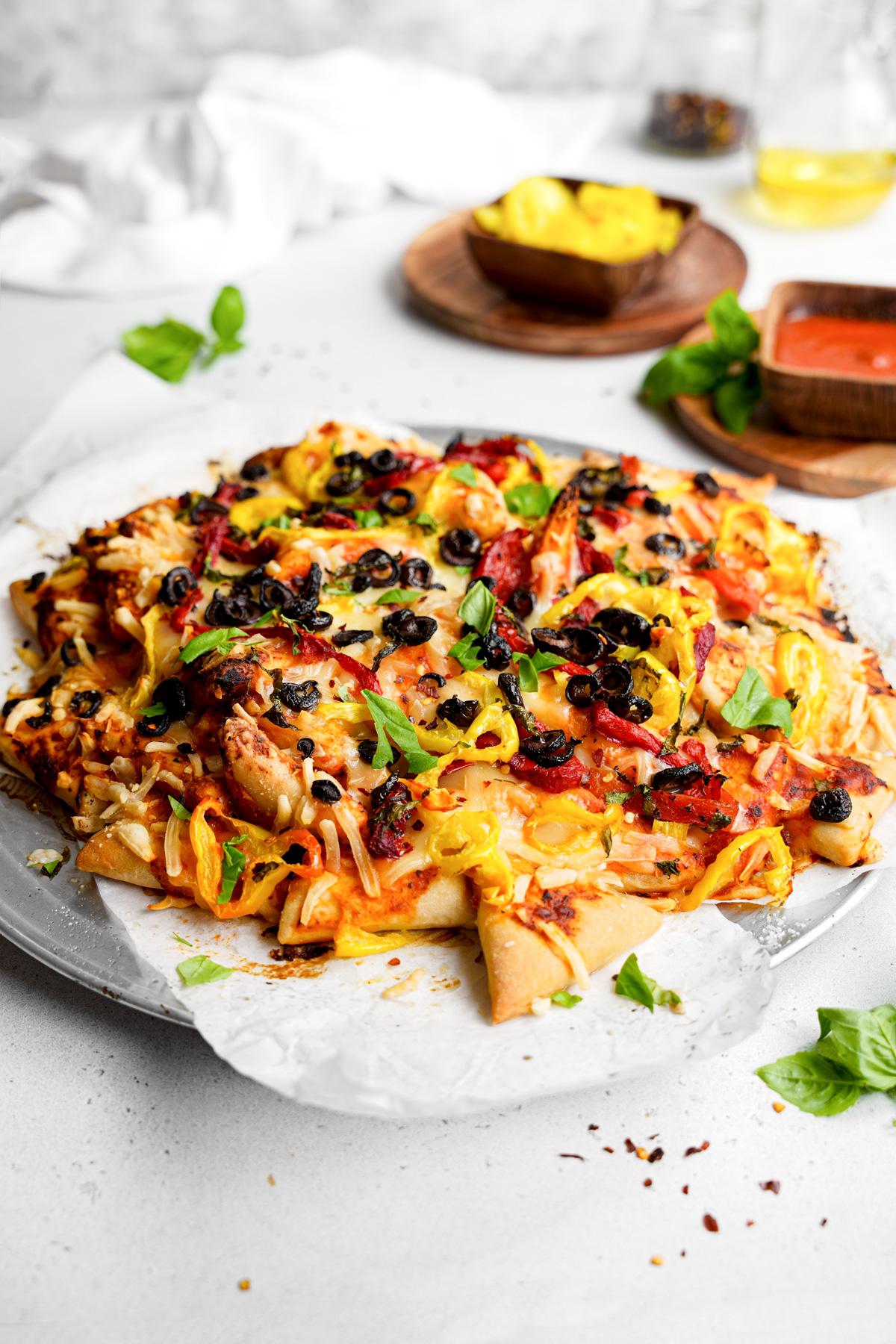 the pizza nachos on a baking sheet baked until the edges are crispy