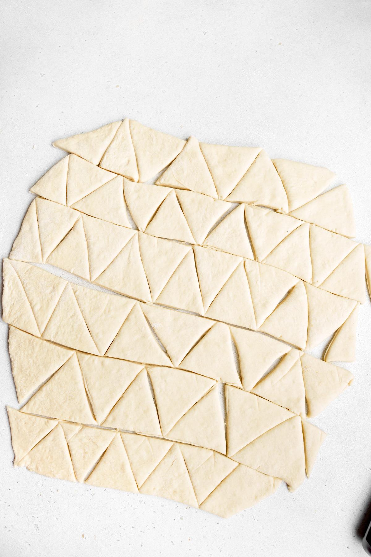 cutting the dough into triangle chips