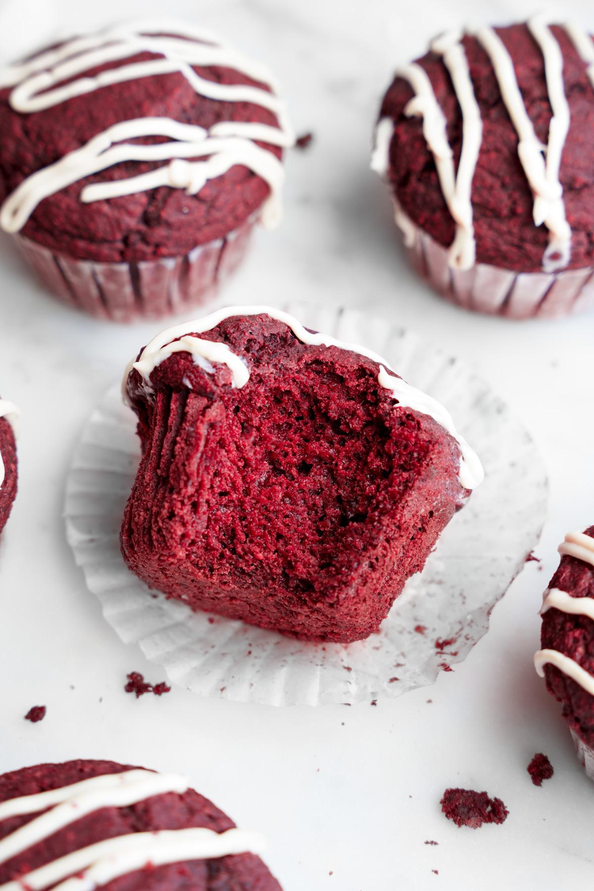the red velvet muffins with a bite taken out of the muffins