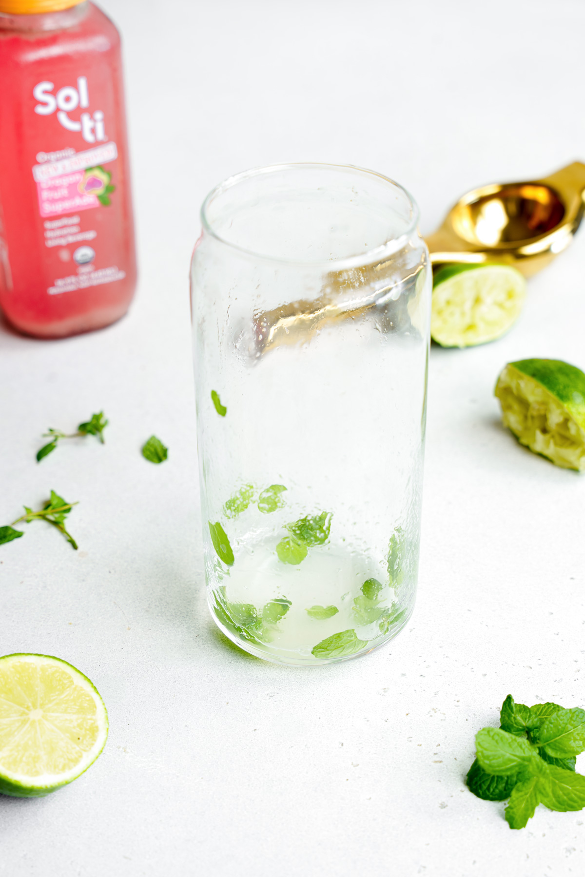 step one of mixing the lime juice and mint together
