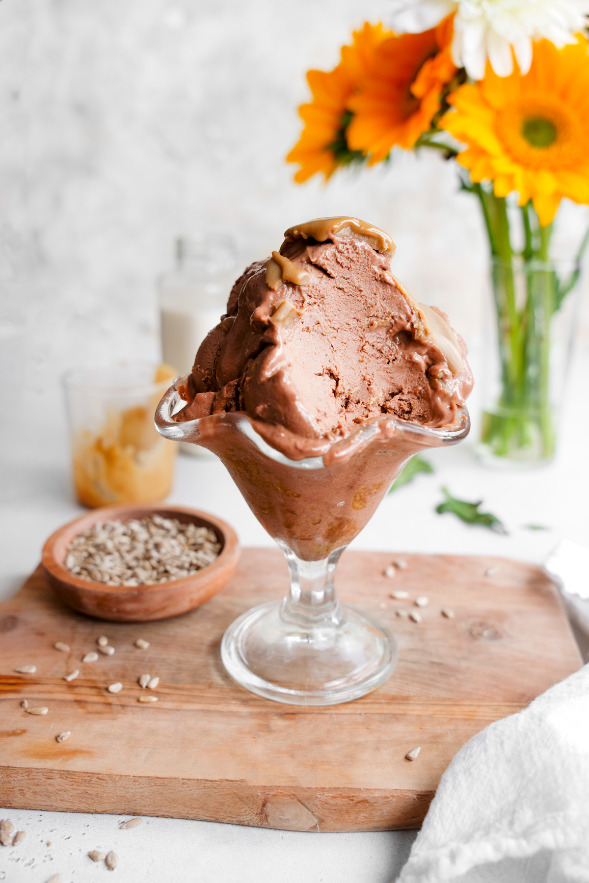 close up of the chocolate sunbutter ice cream with a scoop out to show the creamy texture