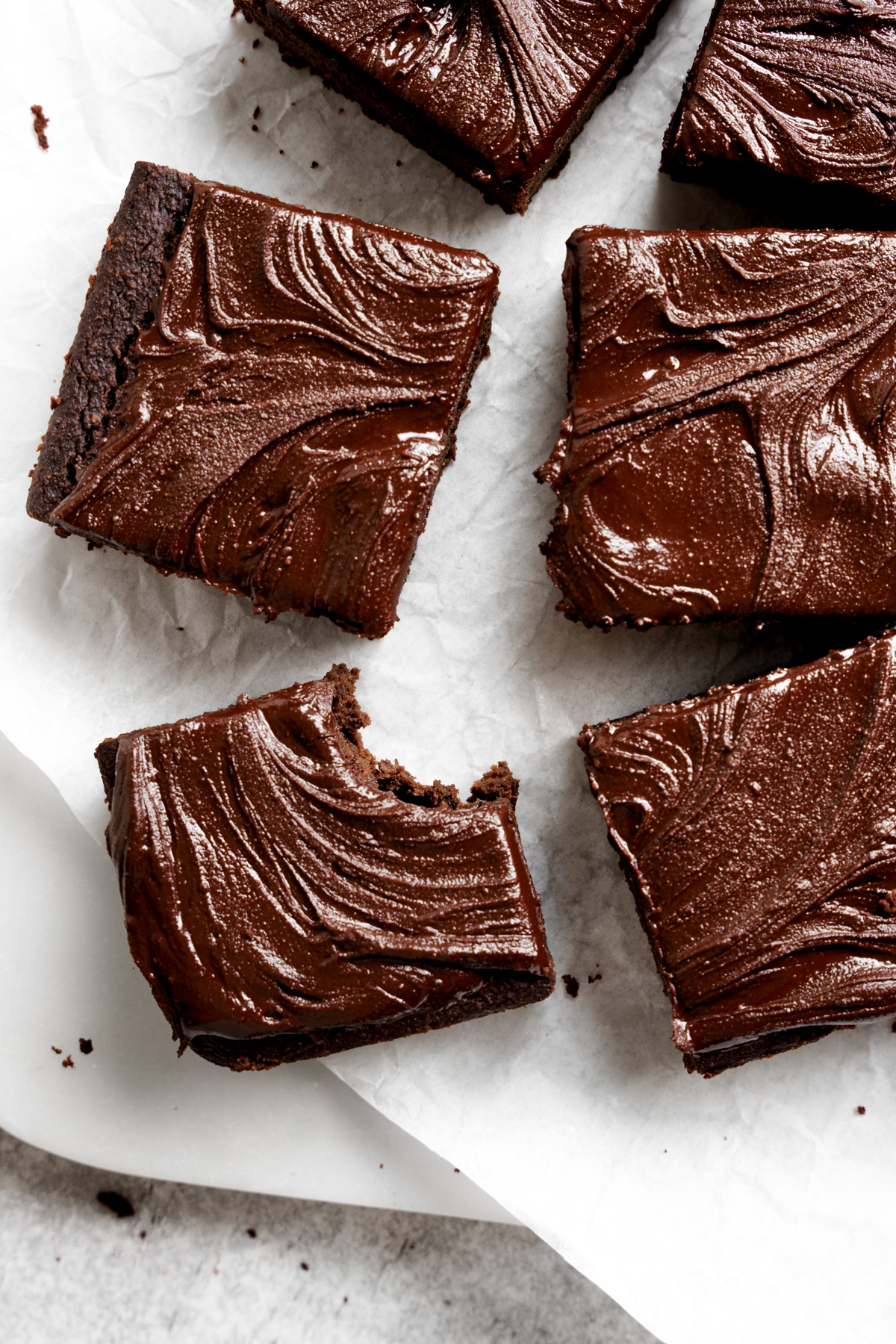 the vegan protein brownies with the chocolate frosting on them