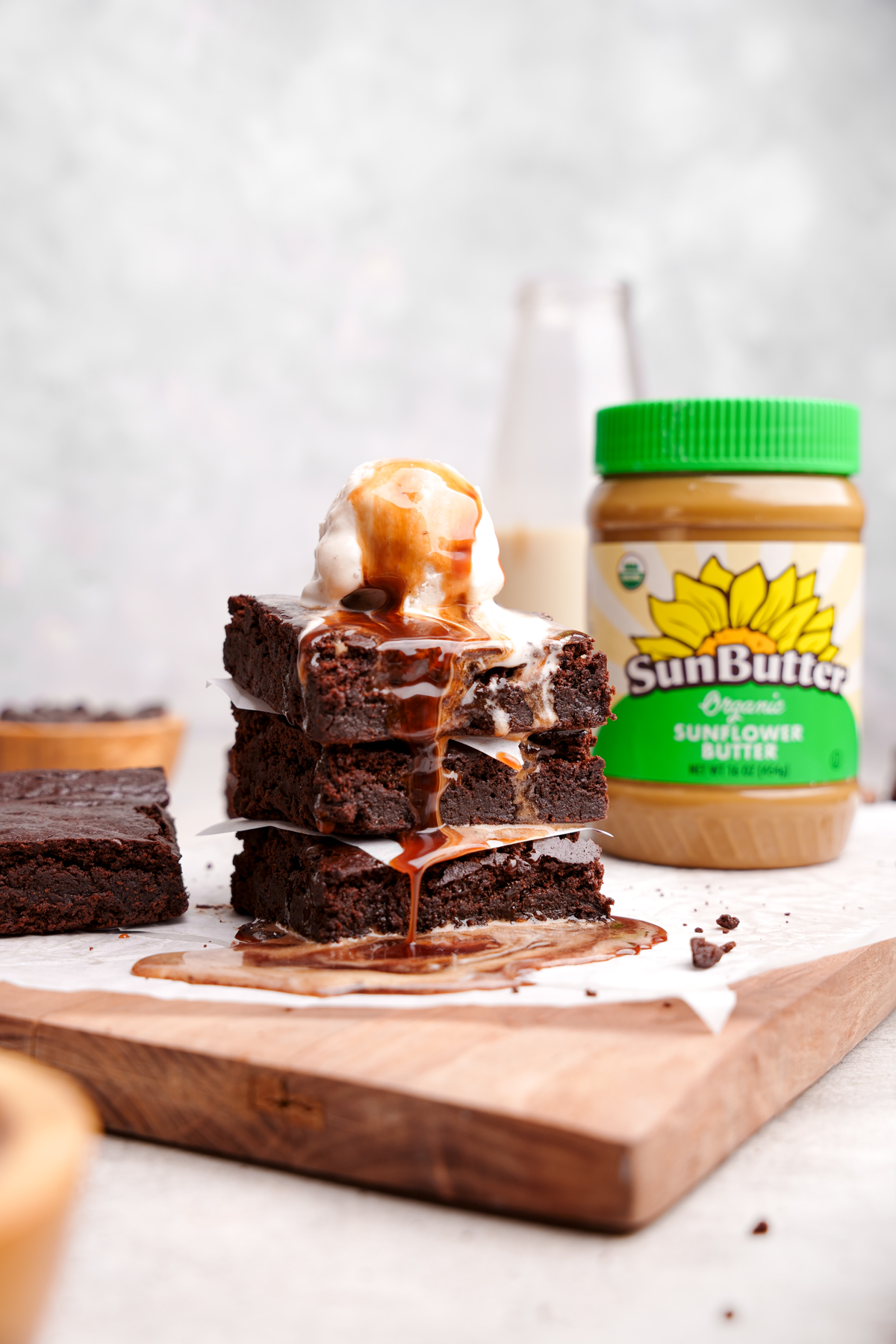 the nut-free brownies stacked on top of each other with the sunbutter organic sunflower seed butter