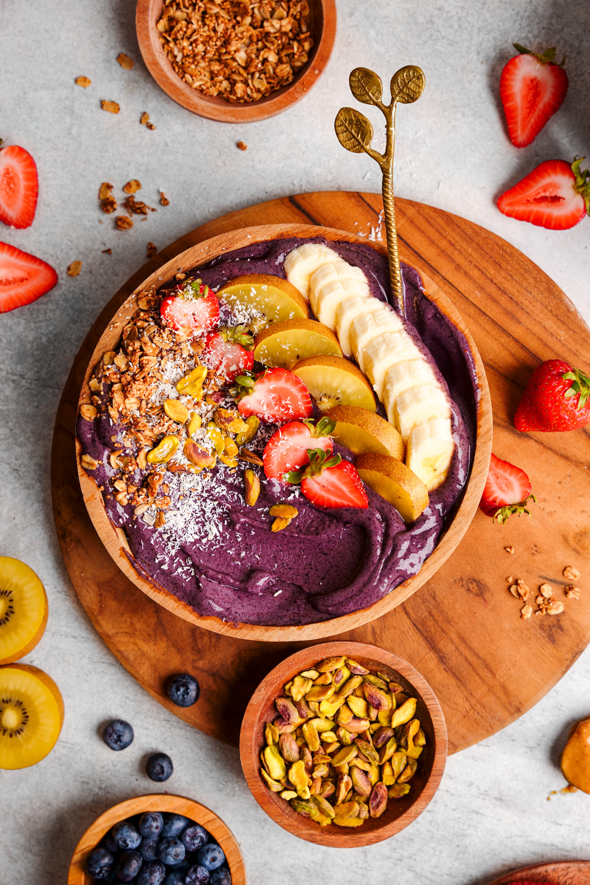 the vegan acai bowl with a spoon in it