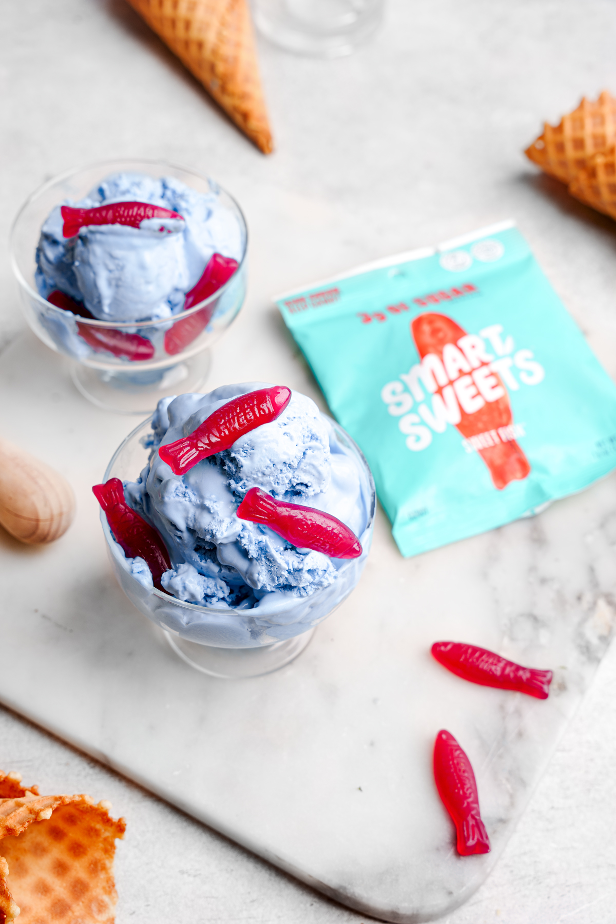 the blue candy ice cream next to the smart sweets sweet fish candy package
