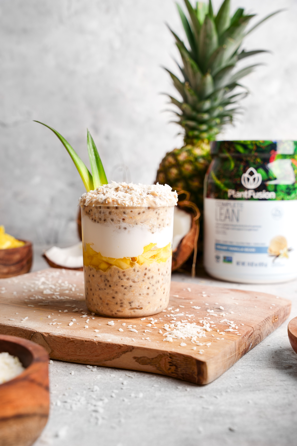 the pina colada overnight oats with the plantfusion protein next to it