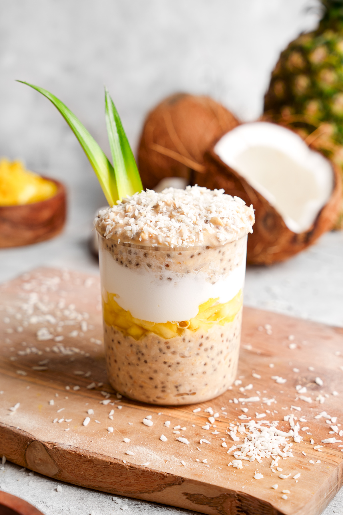 looking down at the pina colada overnight oats to show the different layers of pineapple oats coconut yogurt