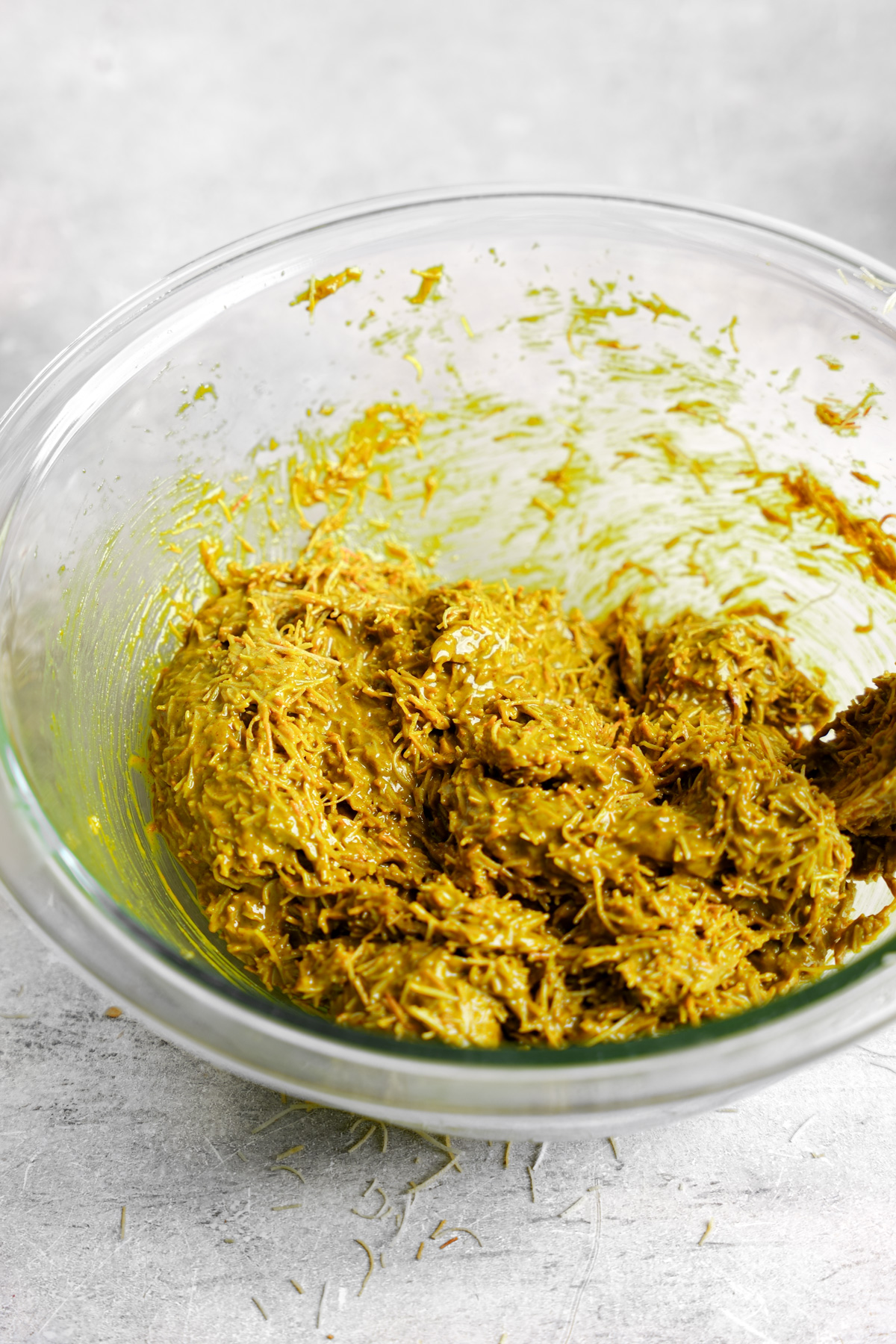 adding the pistachio butter to the toasted phyllo dough