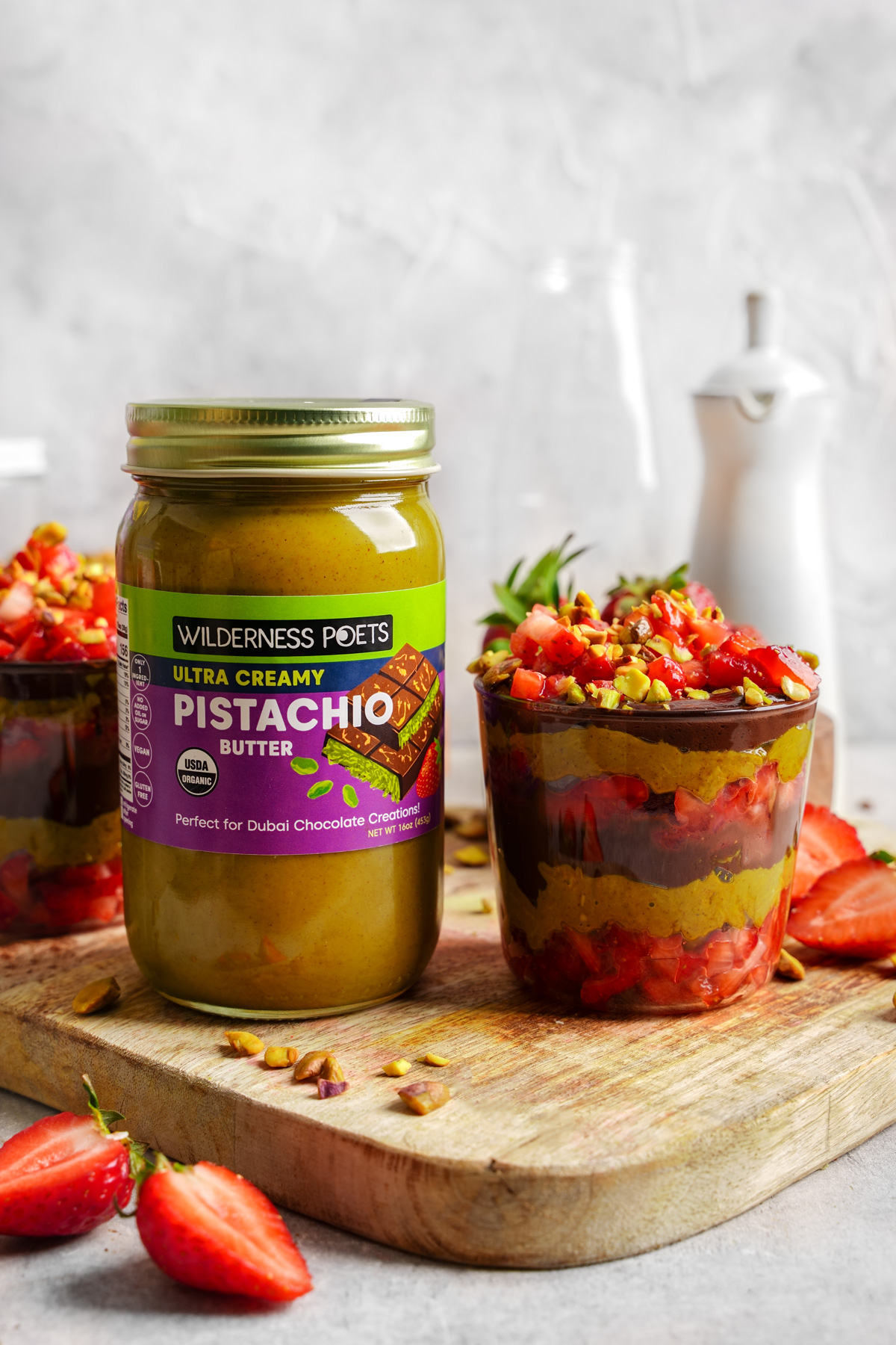 the dubai chocolate strawberries next to the wilderness poets ultra creamy pistachio butter
