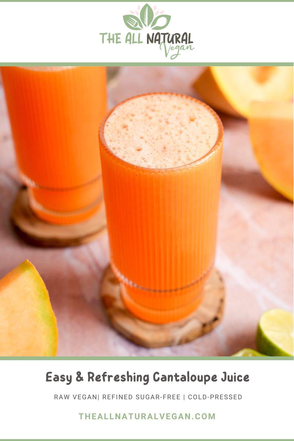 Glass of raw vegan cantaloupe juice with a light frothy top, served on a wooden coaster and surrounded by fresh cantaloupe slices and lime halves—cold-pressed, refined sugar-free, and naturally hydrating.